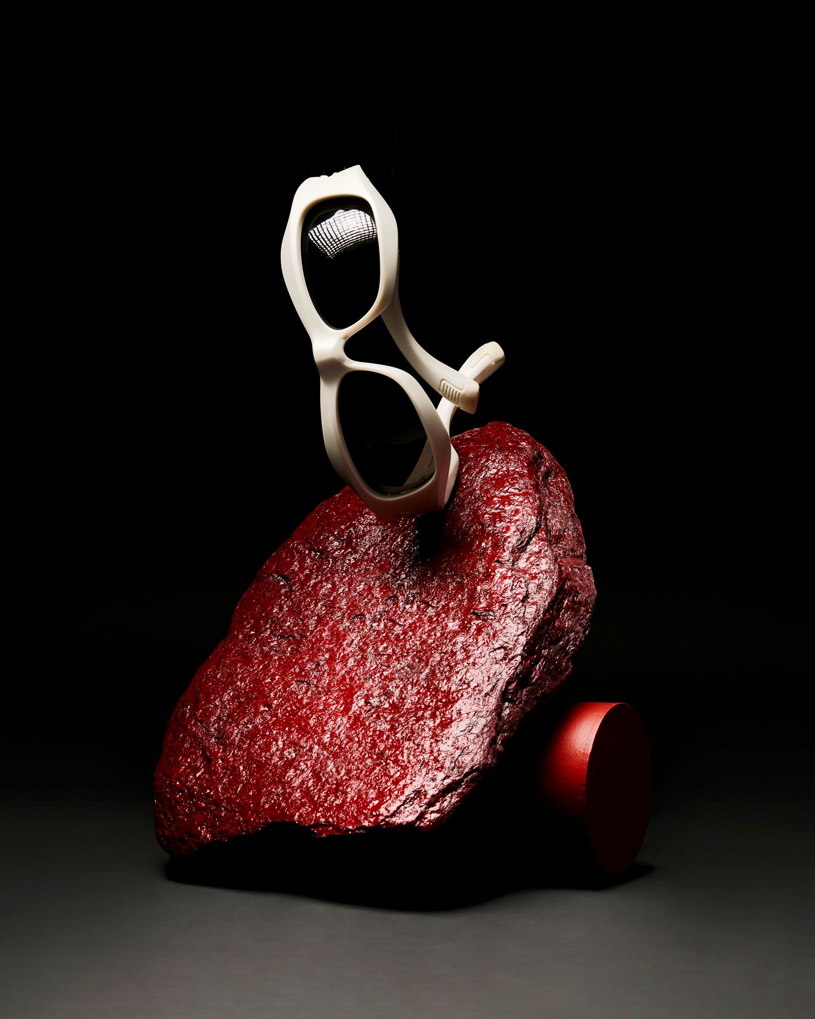 ALT HOUSE portfolio imagery: white sunglasses on a red sculptural rock