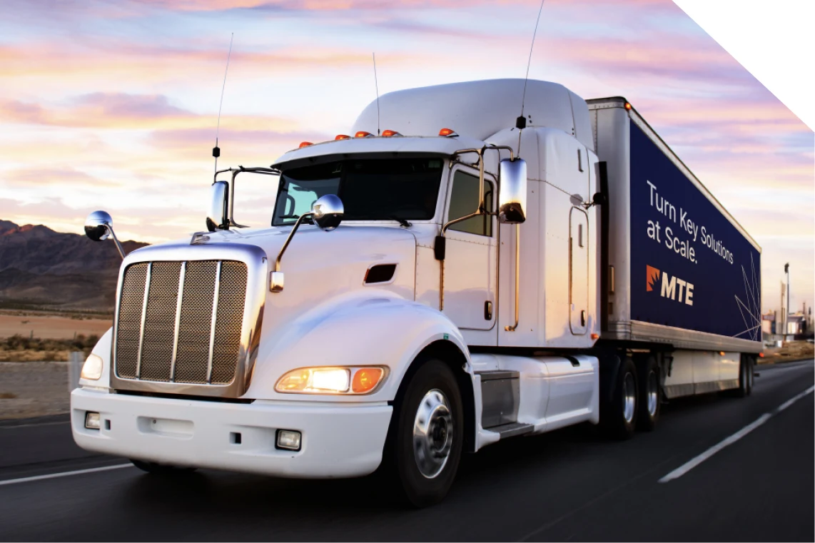 MTE-branded truck on a highway at sunset